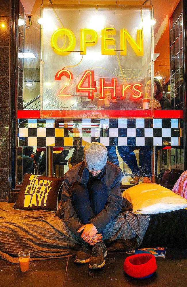 ‘NOT HAPPY’: A man, aged about 30, who didn't want to give his name, outside Hungry Jacks in Bourke Street. Picture: Ian Currie