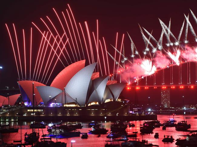 New Year's Eve fireworks erupt over Sydney's iconic Harbour Bridge and Opera House during the fireworks show on January 1, 2019. (Photo by PETER PARKS / AFP)