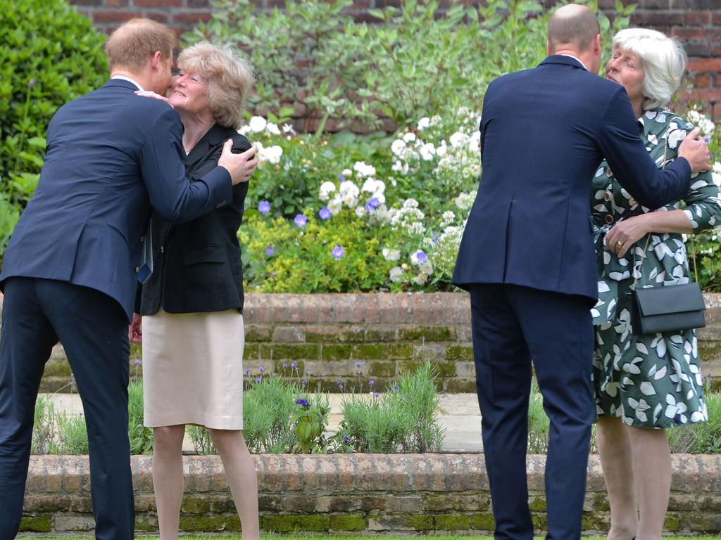 Britain's Prince William, Duke of Cambridge (2R) and Britain's Prince Harry, Duke of Sussex (L) greet their aunts Lady Sarah McCorquodale (2L) and Lady Jane Fellowes (R) at the unveiling of a statue of their mother, Princess Diana at The Sunken Garden in Kensington Palace.