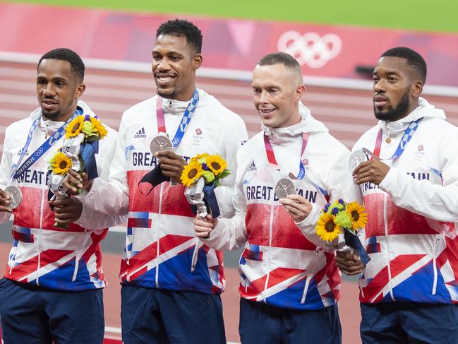 TOKYO, JAPAN August 7:  CJ Ujah, Zharnel Hughes, Richard Kilty and Nethaneel Mitchell-Blake of Great Britain with their silver medals on the podium after the 4 x 100m relay for men during the Track and Field competition at the Olympic Stadium at the Tokyo 2020 Summer Olympic Games on August 7th, 2021 in Tokyo, Japan. (Photo by Tim Clayton/Corbis via Getty Images)