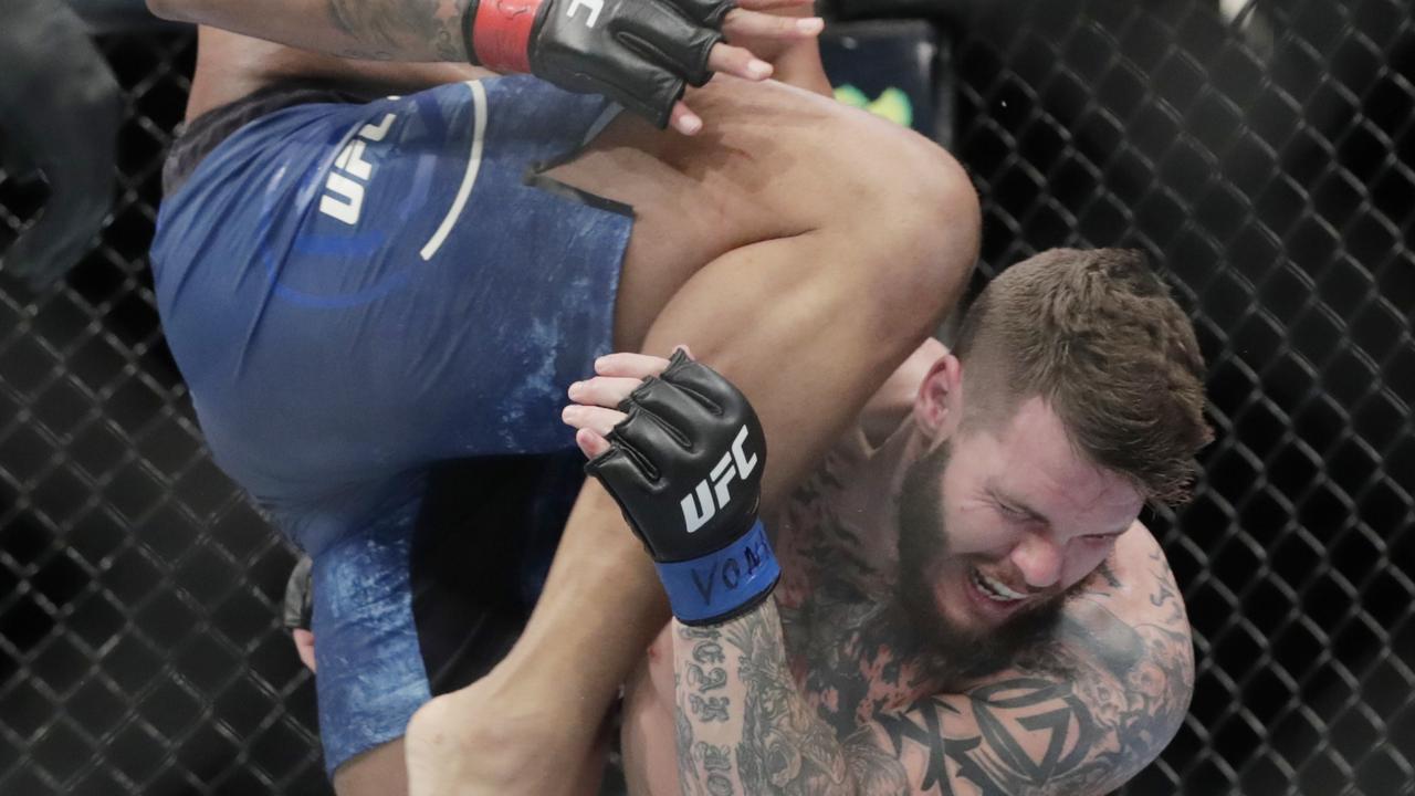 Greg Hardy knees Allen Crowder in the head at UFC Fight Night in New York.