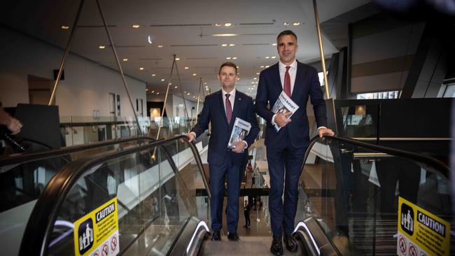 Premier Peter Malinauskas and Treasurer Stephen Mullighan with the budget paper arrive at the Adelaide Convention Centre for the media lockup. Picture: NCA NewsWire / Emma Brasier.