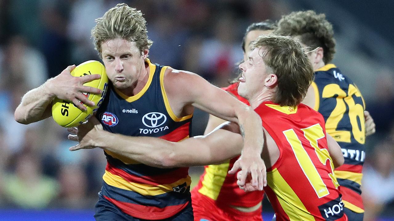 ADELAIDE, AUSTRALIA - APRIL 02: Rory Sloane of the Crows tries to get past Noah Anderson of the Suns during the 2021 AFL Round 03 match between the Adelaide Crows and the Gold Coast Suns at Adelaide Oval on April 02, 2021 in Adelaide, Australia. (Photo by Sarah Reed/AFL Photos via Getty Images)