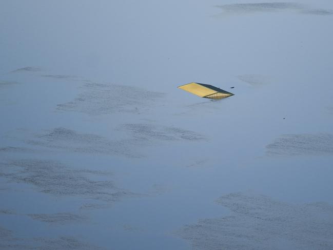 The roof of a submerged structure is seen from a helicopter in flood affected areas in the Windsor and Pitt Town areas along the Hawkesbury River near Sydney. Picture: AAP