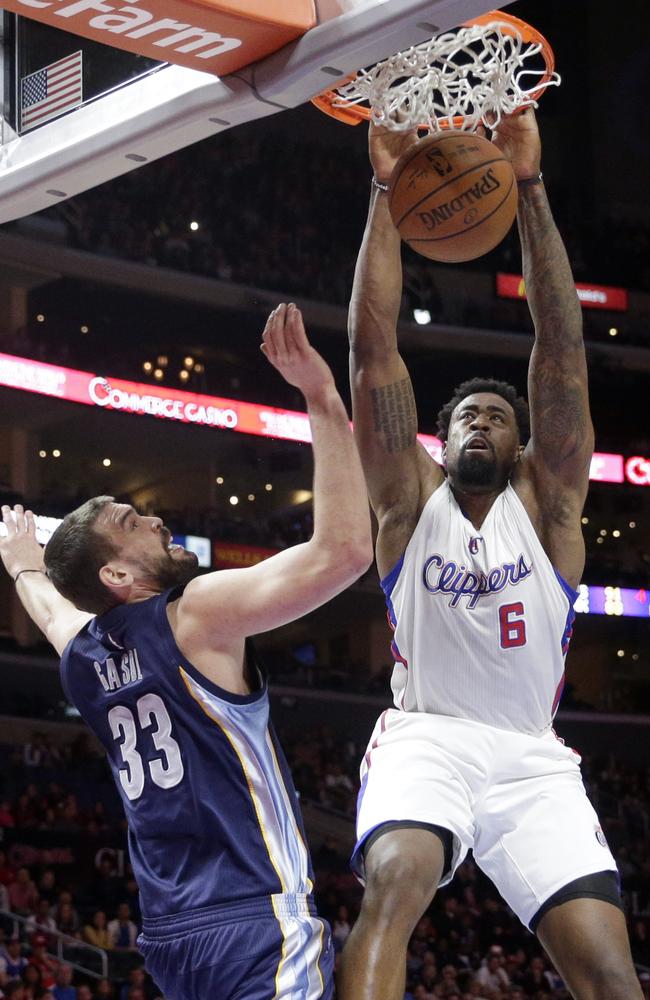 Los Angeles Clippers' DeAndre Jordan, left, dunks against Memphis Grizzlies' Marc Gasol.