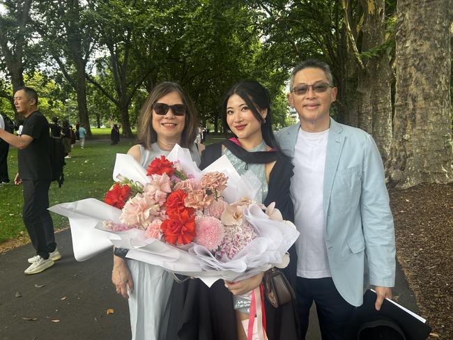 Mao Huig Hii with her parents at the University of Melbourne's Faculty of Architecture, Building and Planning graduation ceremony at the Royal Exhibition Building on December 6, 2024. Picture: Harvey Constable