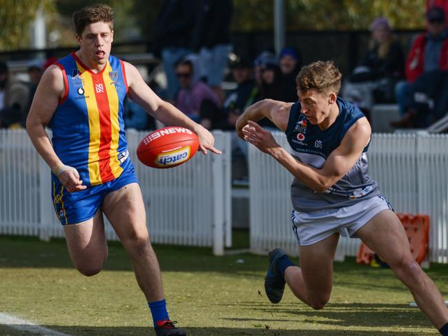 Adelaide Footy League division two match - Old Ignatians v Henley at Karen Rolton Oval Saturday August 22, 2020. Henley player Liam Martin tries to keep the ball in ahead of Jack Armfield from Old Ignatians. Picture: Brenton Edwards