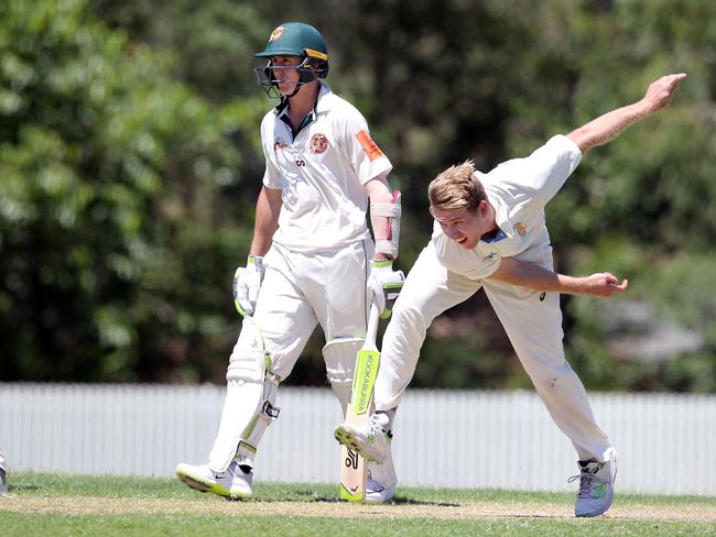 Gold Coast Dolphins quick Trent Arnold bowls as Redlands’ Marnus Labuschagne watches on. Picture: Richard Gosling