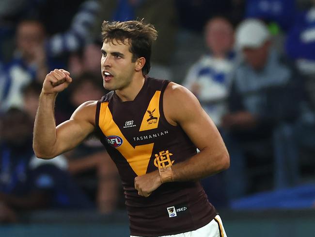 MELBOURNE, AUSTRALIA - APRIL 21: Finn Maginness of the Hawks celebrates kicking a goal during the round six AFL match between North Melbourne Kangaroos and Hawthorn Hawks at Marvel Stadium, on April 21, 2024, in Melbourne, Australia. (Photo by Quinn Rooney/Getty Images)