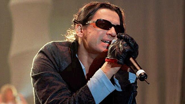 Hutchence performs at a concert in London just months before his death. 