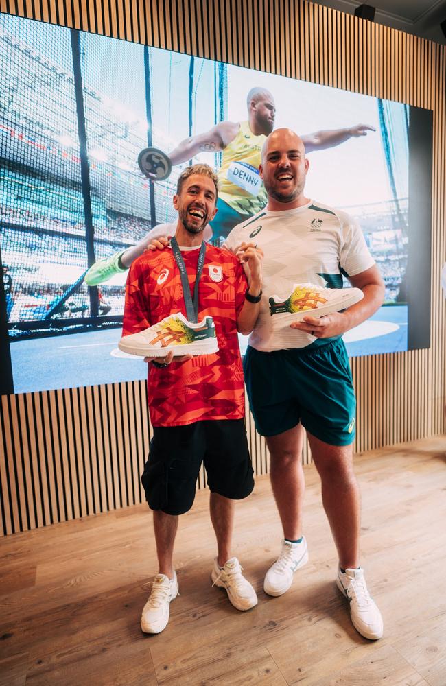 Australian discus thrower Matthew Denny with artist Anarchimyst who painted custum Asics shoes to celebrate Matt's bronze medal at the Paris, 2024.