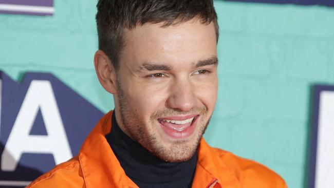 (FILES) British singer-songwriter Liam Payne poses on the red carpet arriving to attend the 2017 MTV Europe Music Awards (EMA) at Wembley Arena in London on November 12, 2017. Liam Payne, who died aged 31 after plunging from a hotel balcony in Buenos Aires, on October 16, 2024 spent more than half his life in the public eye as a member of one of the world's most successful boy bands. (Photo by Daniel LEAL / AFP)