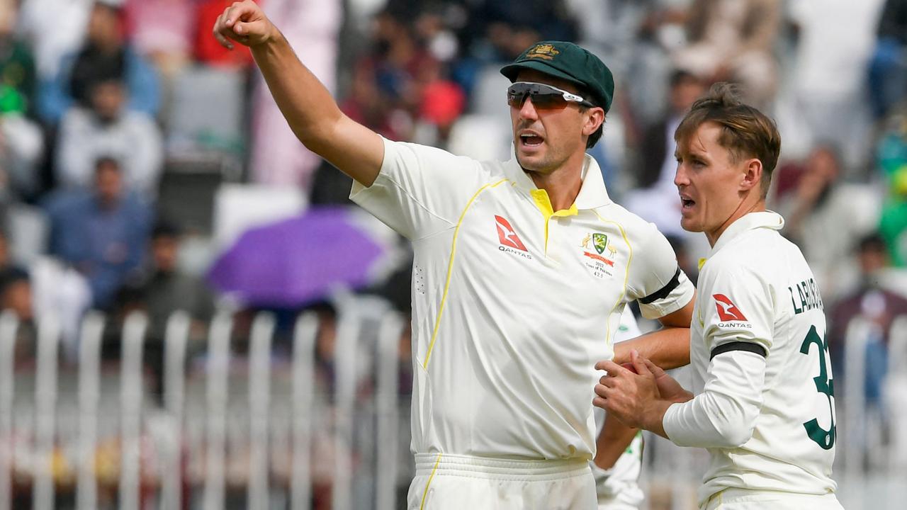 Australian captain Pat Cummins with Marnus Labuschagne. Photo by Aamir QURESHI / AFP