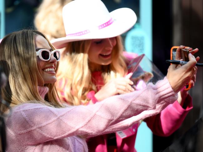 Margot Robbie poses for photos with fans. Picture: Getty Images