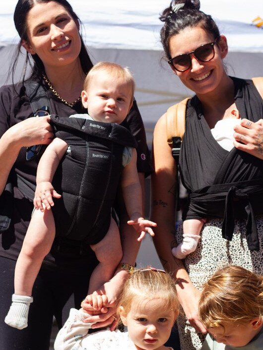 Lauren Flanigan (left) with Sophia and baby Royce with Pauline LeHir with baby Junah and Romy at the Moore Park Beach Arts Festival.