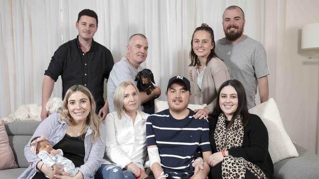 Bottom: Jack’s sister Sam with newborn Scarlett Gower-Wood, his mum Tina, Jack McIlvar, girlfriend Hannah Beer. Top: Brother-in-law Jake Gower-Wood, father James, sister-in-law Dorota and brother Brad. Picture: Emma Brasier