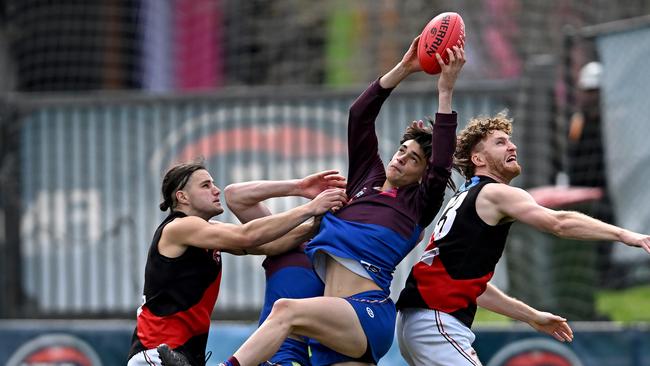 Banyule’s James Kayrooz takes a strong contested mark. Picture: Andy Brownbill