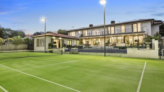 A tennis court is among the features in this Mt Eliza home.