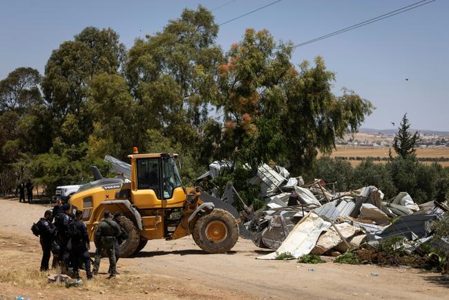 Israeli security forces demolish Bedouin homes in the Negev desert which authorities have described as 'illegal' constructions