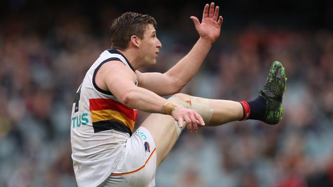 Josh Jenkins kicks for goal for the Crows during the Round 19 AFL match between the Carlton Blues and the Adelaide Crows at the MCG. Picture: AAP Image/David Crosling