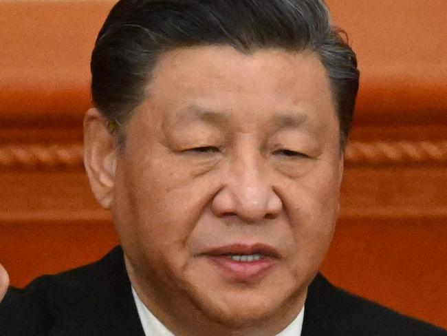 China's President Xi Jinping swears under oath after being re-elected as president for a third term during the third plenary session of the National People's Congress (NPC) at the Great Hall of the People in Beijing on March 10, 2023. (Photo by NOEL CELIS / AFP)