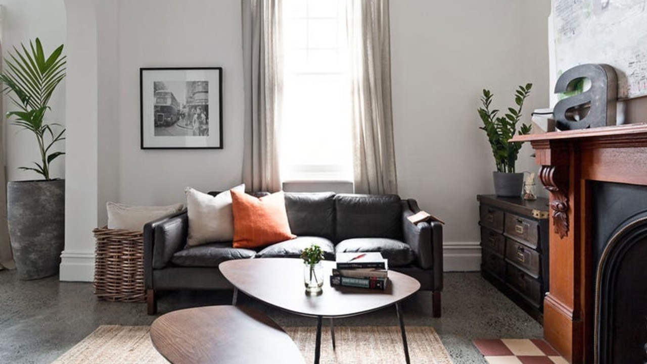 The living room has an open fireplace.