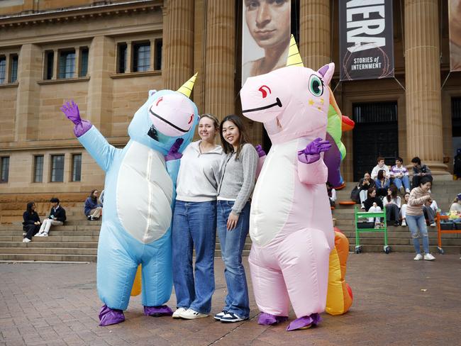 HSC students Chloe Marchant and Naomi Wu were among those whisked outside to grab some free snacks and drinks and get fresh air. Picture: Richard Dobson