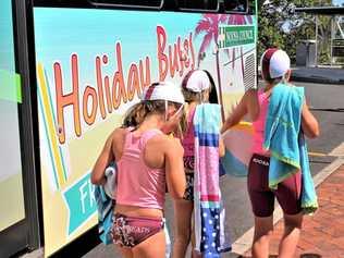 ALL ABOARD: The Noosa nippers headed to the beach the travel smart way on a free holiday bus over Christmas. Picture: Contributed