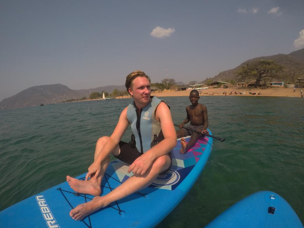 James on a canoe on the Malawi River, where he contracted schistosomiasis. Picture: SWNS / Mega