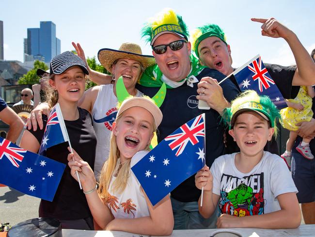 People lined Swanston St in Melbourne to see the the Australia Day parade. Picture: Sarah Matray