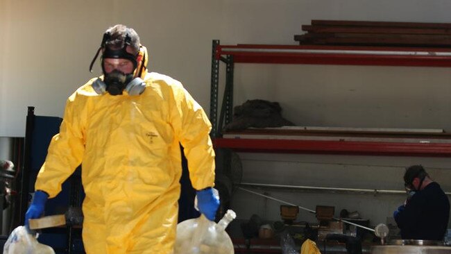 Specialist police officers search the secret lab. Picture: NSW Police