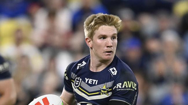 TOWNSVILLE, AUSTRALIA - JULY 06: Tom Dearden of the Cowboys runs the ball during the round 18 NRL match between North Queensland Cowboys and Manly Sea Eagles at Qld Country Bank Stadium, on July 06, 2024, in Townsville, Australia. (Photo by Ian Hitchcock/Getty Images)