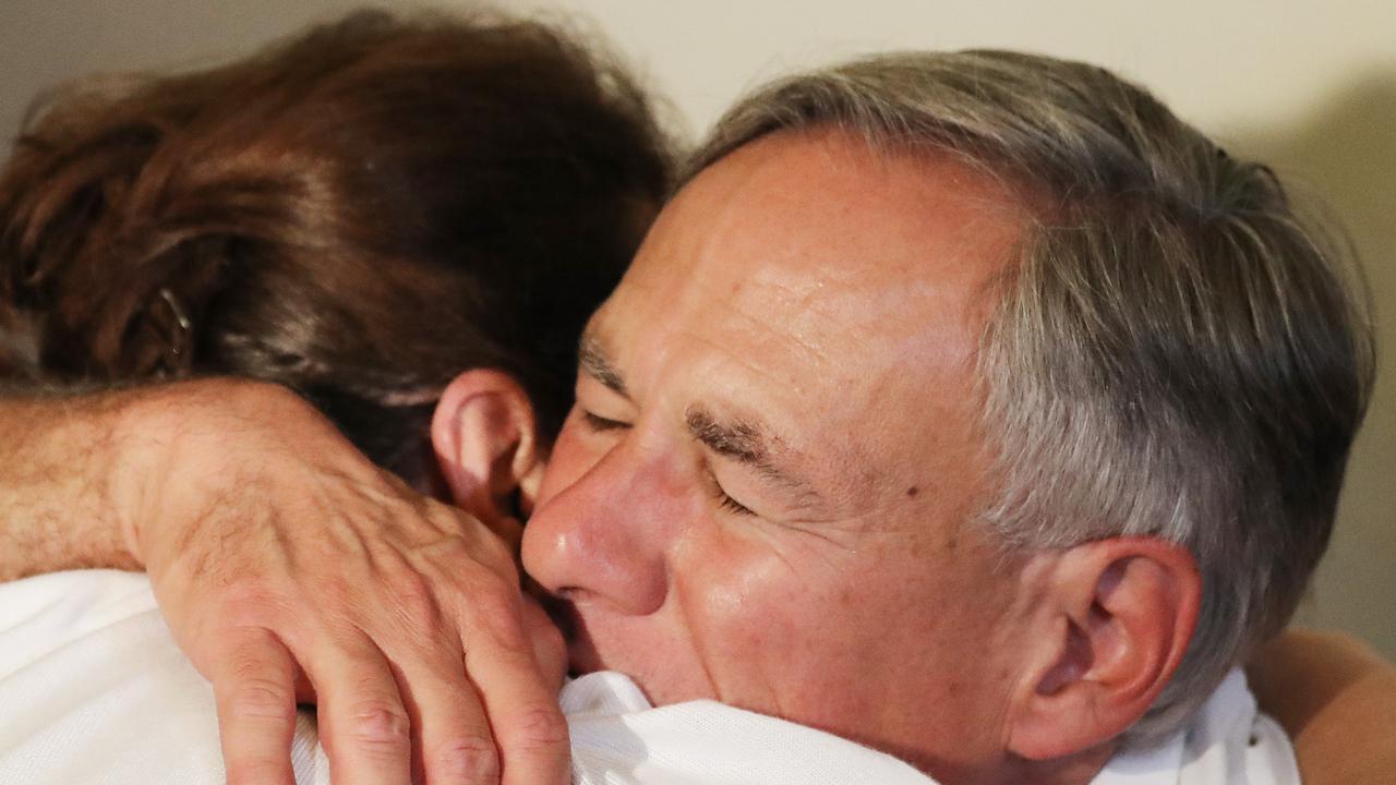 Texas Governor Greg Abbott hugs a woman following a vigil for victims at St Pius X Church after a mass shooting which left at least 20 people dead. Picture: Getty