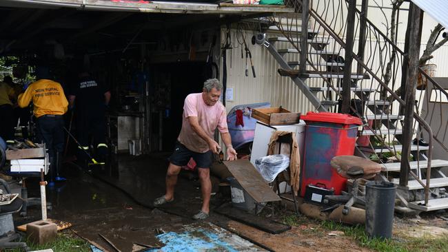 Wednesday February 13. Heavy rain causes flooding in North Queensland. Clean up after flooding in Ingham. Rural firefighters from southern Queensland and NSW help clean up Pastor Joe Marolla's home in Skinner Street. Pastor Marolla. Picture: Evan Morgan