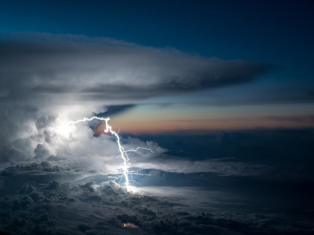 Image Name: Lightning Strike Photographer Name: Santiago Borja Year: 2018 Image Description: A storm is developing over the Ecuadorean Amazonia when all of the sudden, one of its powerful lightning leaves the storm and traces a very particular path in the air before hitting the ground away from the storm. Copyright: Santiago Borja, Winner, Ecuador National Award. Picture: Sony World Photography Awards/ Santiago Borja