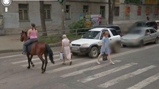 Just a girl riding a horse in the main street. No big deal. Picture: Reddit