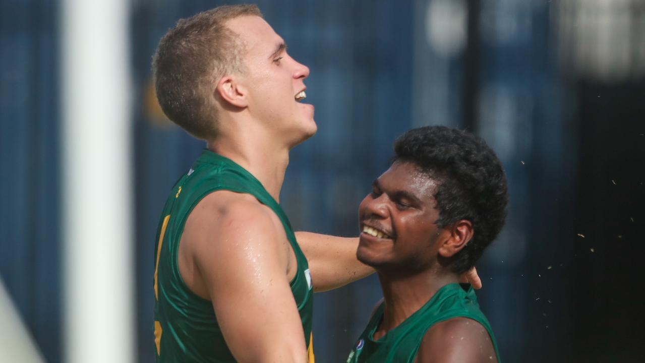 Maurice Rioli Jr (right) celebrates a goal with Shaun Edwards in the NTFL. Photo: Glenn Campbell