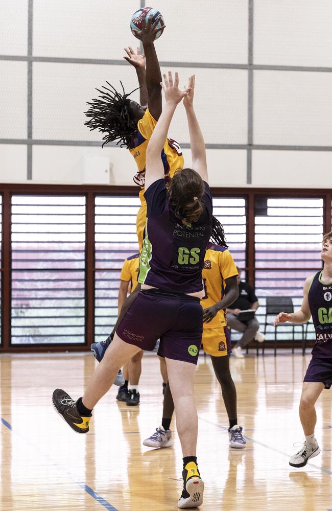 St James College (yellow) vs. Calvary Christian College (purple). Ethan Kamuti (yellow) out jumps Andrew Vidulich (purple) in their match.