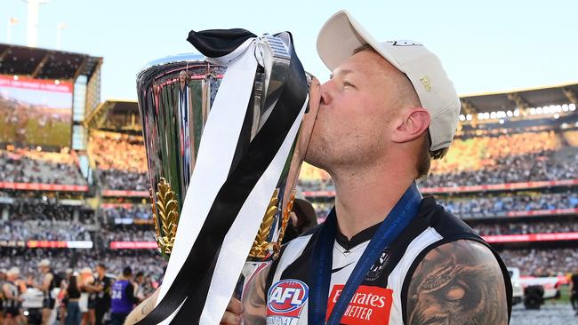 MELBOURNE, AUSTRALIA - SEPTEMBER 30: Jordan De Goey of the Magpies celebrates winning with the AFL Premiership Cup during the 2023 AFL Grand Final match between Collingwood Magpies and Brisbane Lions at Melbourne Cricket Ground, on September 30, 2023, in Melbourne, Australia. (Photo by Quinn Rooney/Getty Images)