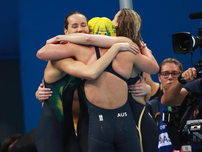 Australia's relay team celebrate after winning silver. Picture: Phil Hillyard