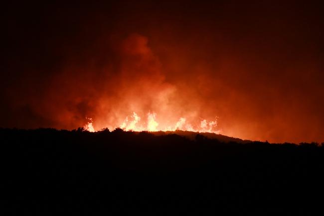 Hundreds of firefighters backed by European Union reinforcements were struggling to contain the flames on the islands of Rhodes, Corfu and Evia