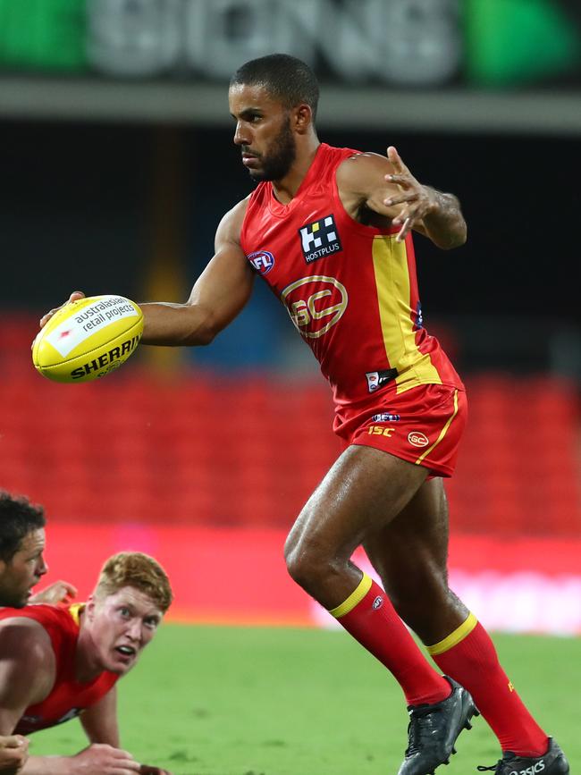 Touk Miller of the Suns kicks during the round 1 AFL match between the Gold Coast Suns and the Port Adelaide Power at Metricon Stadium on March 21, 2020 in Gold Coast, Australia. (Photo by Chris Hyde/Getty Images)