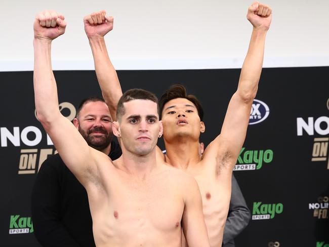 Issac Hardman and Kazuki Kyohara face off during the Issac Hardman vs Kazuki Kyohara weigh in at the Heffron Centre, Sydney. Photo: No Limit Boxing / Brett Costello