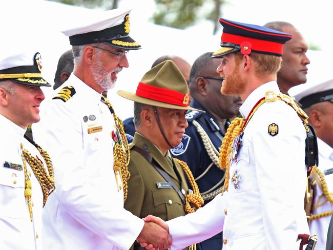 The Duke of Sussex Prince Harry visits the National War Memorial in Suva on day two of the tour of Fiji. Prince Harry speaks with The Australian Defense AttachŽ Commander Andrew Nelson. (tall in white with beard) Picture: Nathan Edwards.