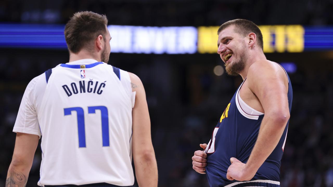 DENVER, COLORADO - NOVEMBER 10: Luka Doncic #77 of the Dallas Mavericks and Nikola Jokic #15 of the Denver Nuggets chat during a free throw in the first half at Ball Arena on November 10, 2024 in Denver, Colorado. NOTE TO USER: User expressly acknowledges and agrees that, by downloading and or using this photograph, user is consenting to the terms and conditions of the Getty Images License Agreement. (Photo by Tyler Schank/Clarkson Creative/Getty Images)