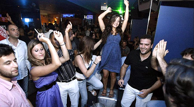 Wild ... partygoers dance at a club in downtown Beirut / AFP