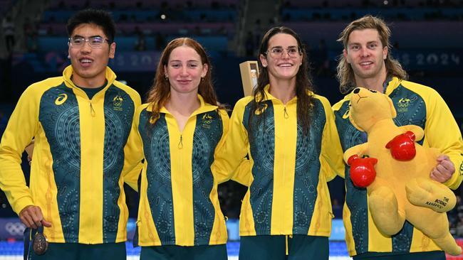 Bronze medallists Joshua Yong, Mollie O'callaghan, Kaylee McKeown and Matthew Temple celebrate making the podium in the 4x100m medley relay final. Picture: AFP