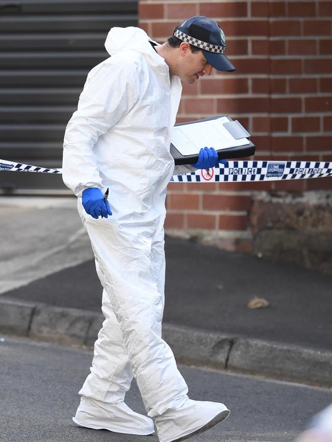 Forensic police officers at the scen in Forest Lodge on August 10. Picture: AAP