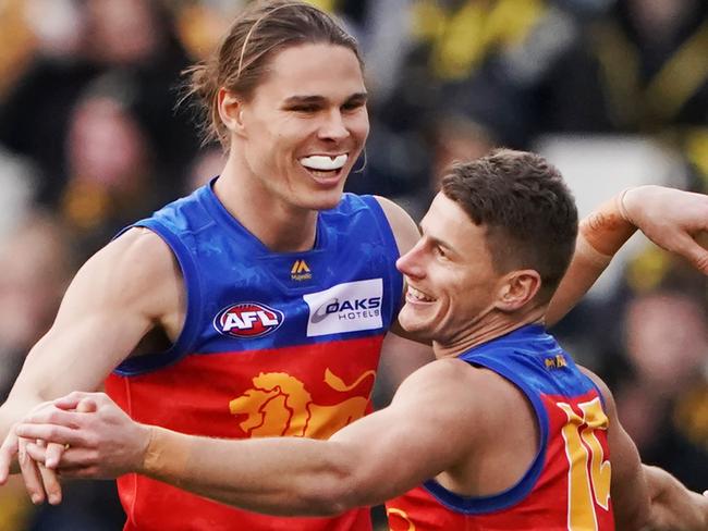 Eric Hipwood of the Lions (left) and Dayne Zorko celebrate a goal during the Round 25 AFL match between the Richmond Tigers and the Brisbane Lions at the MCG in Melbourne, Sunday, August 25, 2019.  (AAP Image/Michael Dodge) NO ARCHIVING, EDITORIAL USE ONLY