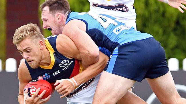 DON’T HURT HIM: Sturt’s Aidan Riley tackles Hugh Greenwood. Picture: Tom Huntley